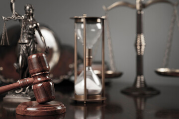 Lawyers office concept. Law symbols composition: Themis sculpture, gavel and scale.