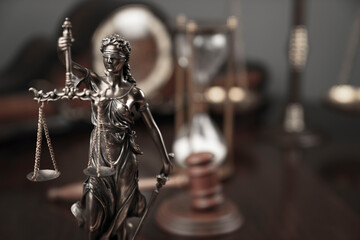 Lawyers office concept. Law symbols composition: Themis sculpture, gavel and scale.