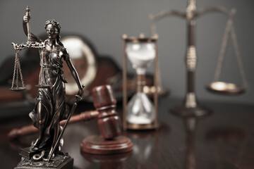 Fototapeta na wymiar Lawyers office concept. Law symbols composition: Themis sculpture, gavel and scale.