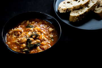 Homemade Ribollita, tuscan bean soup with light rye ciabatta