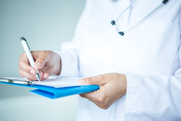 Healthcare - doctor with papers in hand.