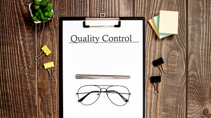 quality control form on a wooden table.