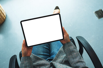 Top view mockup image of a business woman holding digital tablet with blank white desktop screen