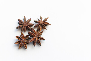 Obraz na płótnie Canvas star anise on a white background. this aromatic spice is used for cooking food and various drinks