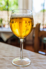 a very cold beer in a glass