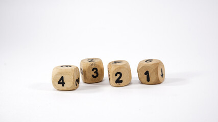 Four wooden dice on white background