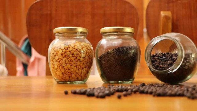 Organic Black Pepper and other spices on the glass jar, Glass jar with spices, home kitchen