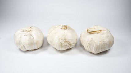 Group of garlic bulbs on white background
