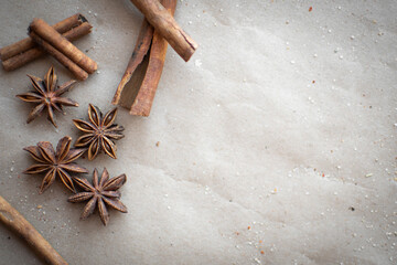 aromatic spice star anise and cinnamon on a gray background. it is used for making mulled wine.