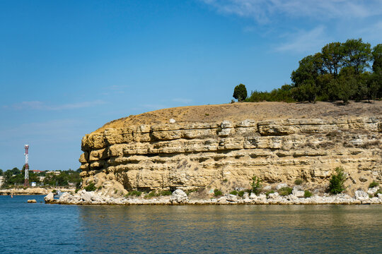 Sandy cliff on the coast of the Black Sea peninsula.
