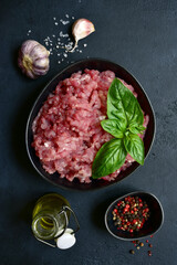 Homemade minced meat with spices. Top view with copy space.