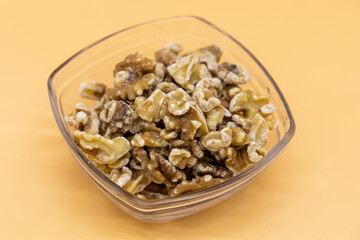 Walnuts in a clear glass tray
