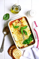 Italian eggplant dish melanzane alla parmigiana. Top view with copy space.