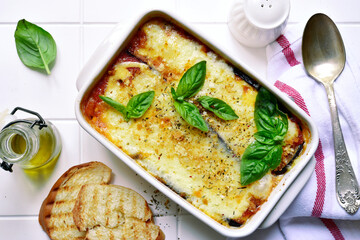 Italian eggplant dish melanzane alla parmigiana. Top view with copy space.