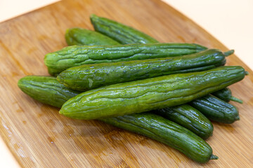 Pickle cucumbers on a cutting board