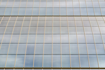 skyscraper in the city, detail of the building of windows with self-supporting glass and modules...