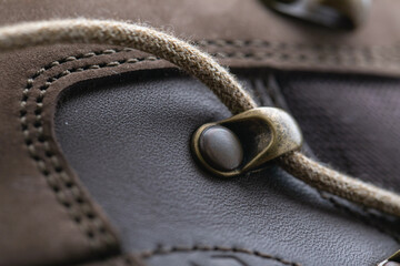 Detail of trekking shoes hook and loop for strap.