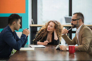 Business people team colleagues in modern office. Man and woman meeting conference and presentation in room.