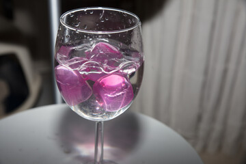  glass with ice cubes on white background