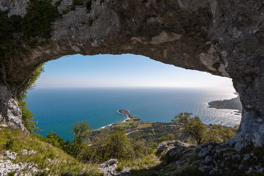 Natural arch called Ojo del Diablo (Eye of the Devil) in Cantabria, Spain