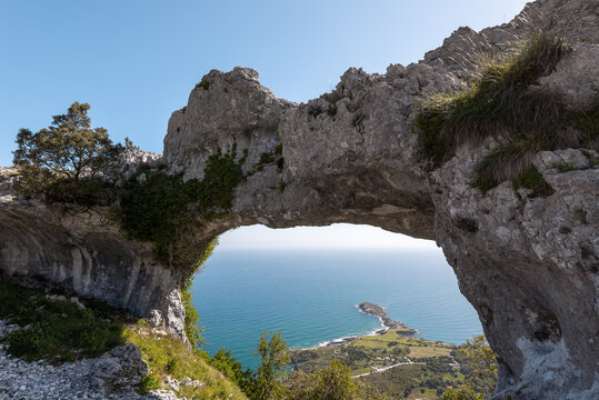 Natural arch called Ojo del Diablo  (Eye of the Devil)  in Cantabria, Spain