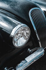 Old classic car headlight detail. Retro car light.