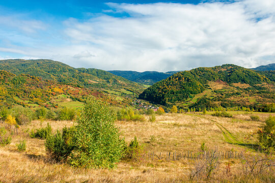 autumnal countryside on a cloudy day. beautiful mountain scenery of carpathians. abandoned rural area