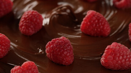 chocolate and berry. melted chocolate and raspberry top view