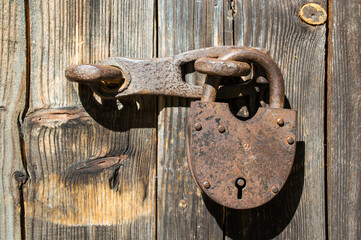old rusty padlock on door