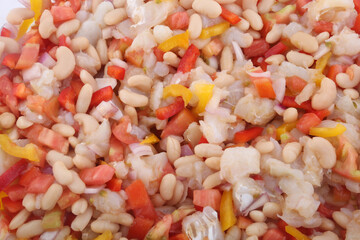 fresh summer salad with beans, cod, tomato and onions