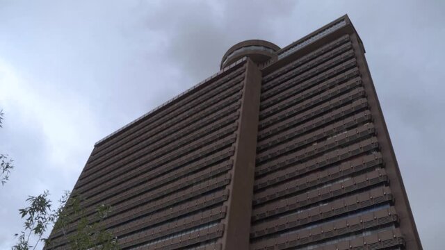 Imposing building on cloudy day low angle