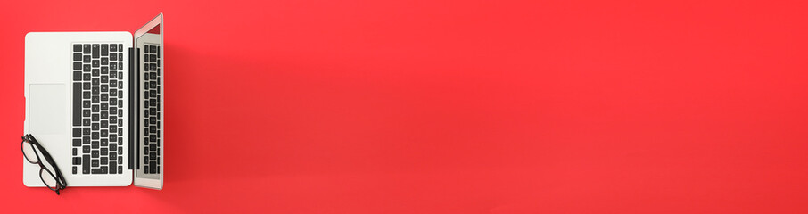 Modern laptop on color background with space for text