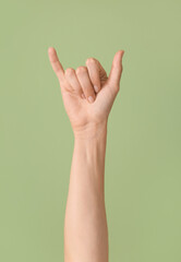 Hand showing letter Y on color background. Sign language alphabet