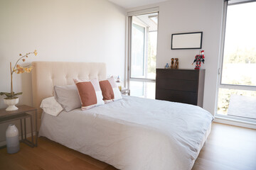 Interior View Of Beautiful Bedroom With Soft Furnishings In New Family House 