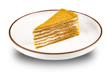 Dessert. Piece of cake on light plate close up on white isolated background