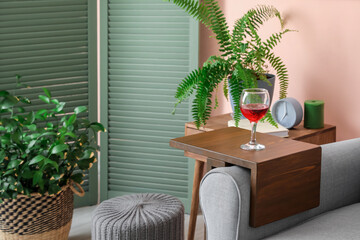 Armrest table on armchair in interior of room