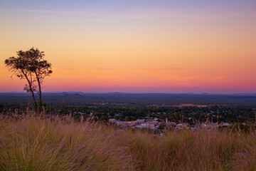 Sunset at lookout with tree, Charters Towers, Queensland, Australia. 