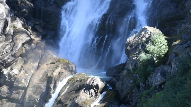 The water flows foaming from the Rutor waterfall, in the Aosta Valley