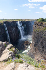 Fototapeta na wymiar Victoria Falls is a waterfall on the Zambezi River on the border between Zambia and Zimbabwe and is considered to be one of the world's largest. Extreme weather conditions are threatening its existenc