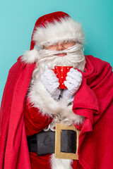 Santa Claus having influenza, drinking tea