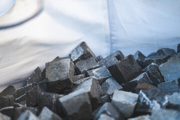 A pile of cobblestones in big bag for transportation
