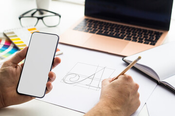 Phone mock up on graphic design studio
