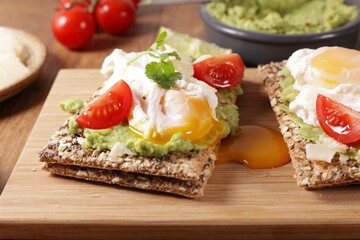 crispy bread with avocado and poached egg