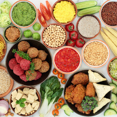 Vegan super food diet for ethical eating with foods high in antioxidants, protein, omega 3, dietary fibre, anthocyanins, smart carbs, vitamins & minerals. Plant based diet concept. Flat lay on marble.