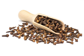 Dried clove spice in the wooden scoop isolated  on white background.
