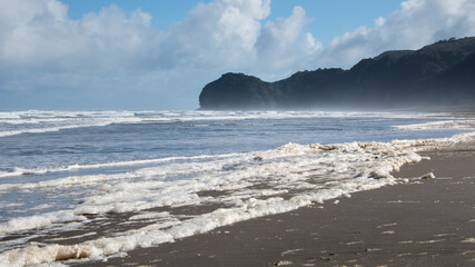 Sea foam on Piha beach, Waitakere, Auckland
