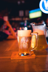 Beer poured into glasses in the bar at night.