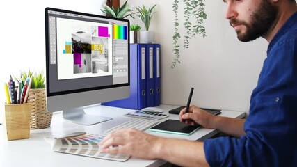 Graphic designer working with computer and graphic tablet - Powered by Adobe