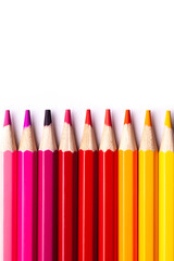 multi-colored wooden pencils in red shades on a white isolated background, mock up, vertically.