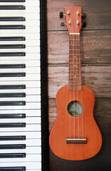 Fototapeta premium white black piano keys and guitar with a strings